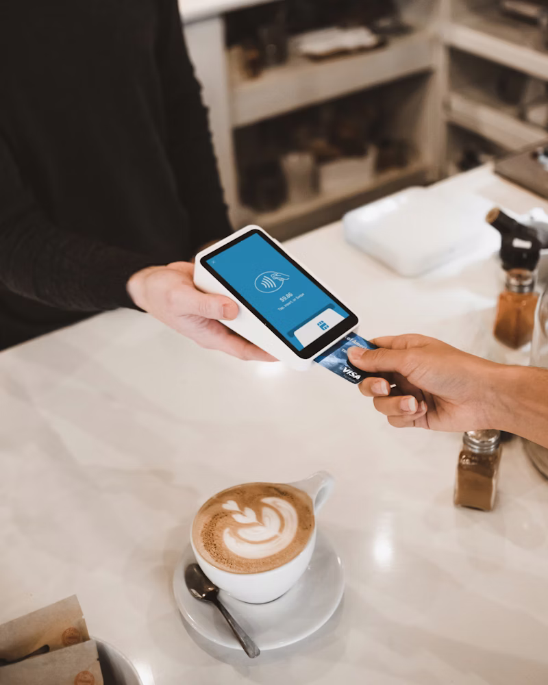Handheld terminal pulling a live Simphony check at the table